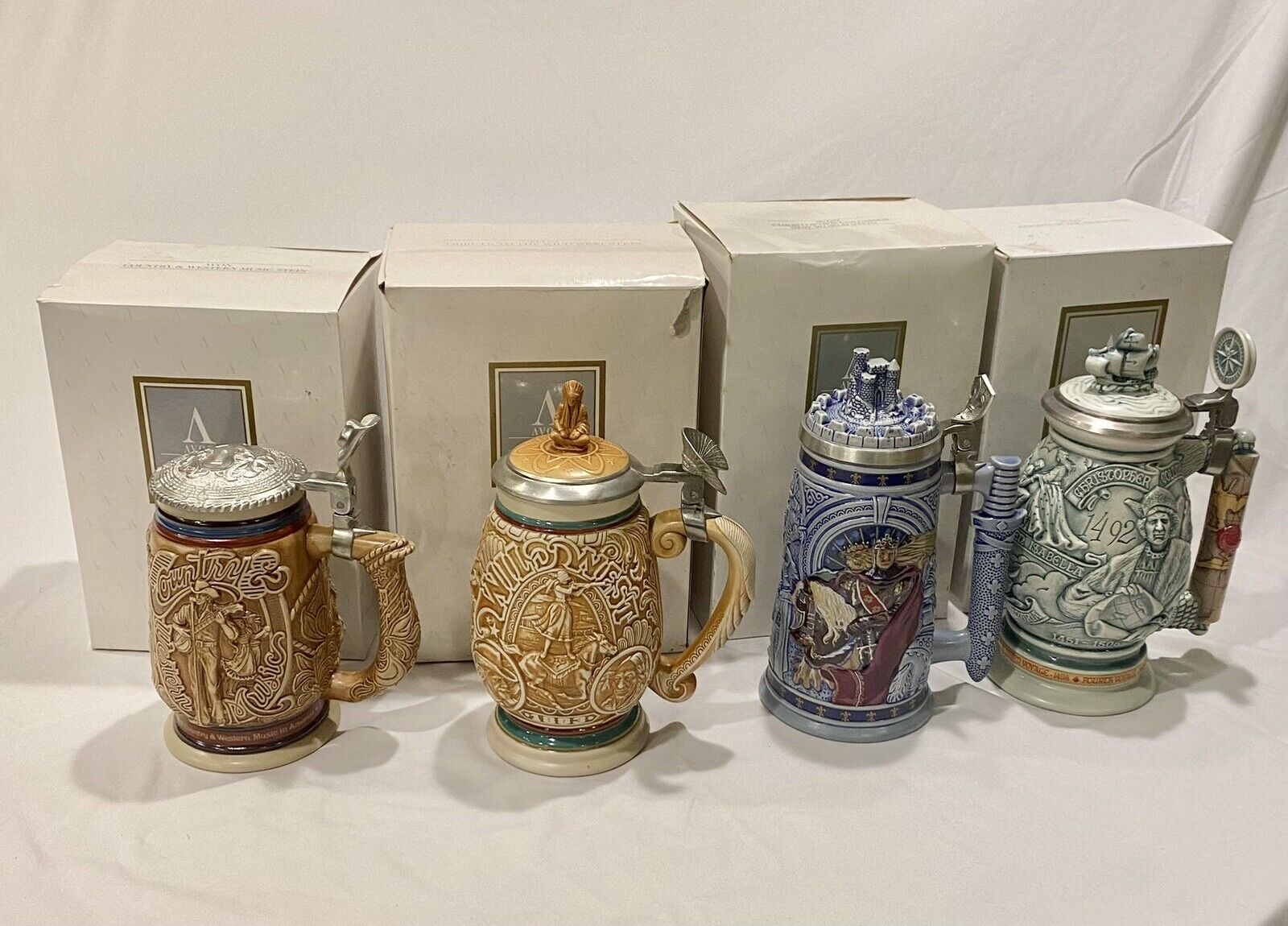 4 Brand new Avon lidded steins hand crafted in Brazil, with original packaging