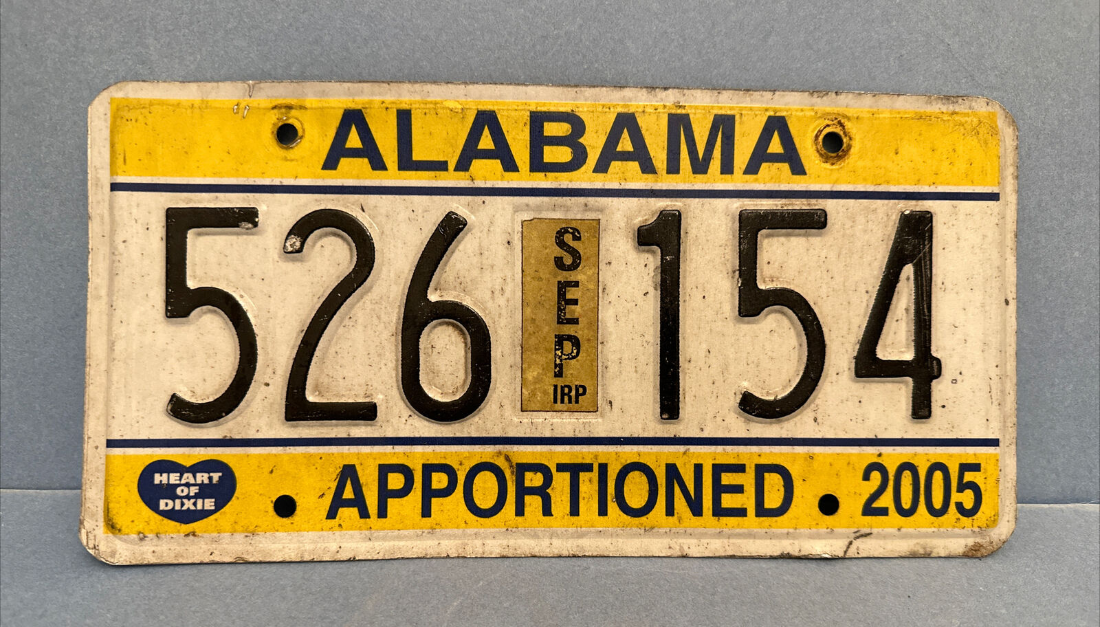 526 154 ~ 2005 Alabama APPORTIONED License Plate w/STICKER, BLACK RAISED LETTERS