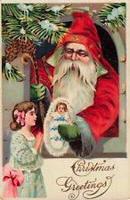Christmas Greetings Santa Claus Giving Doll to Girl c1910 Postcard picture