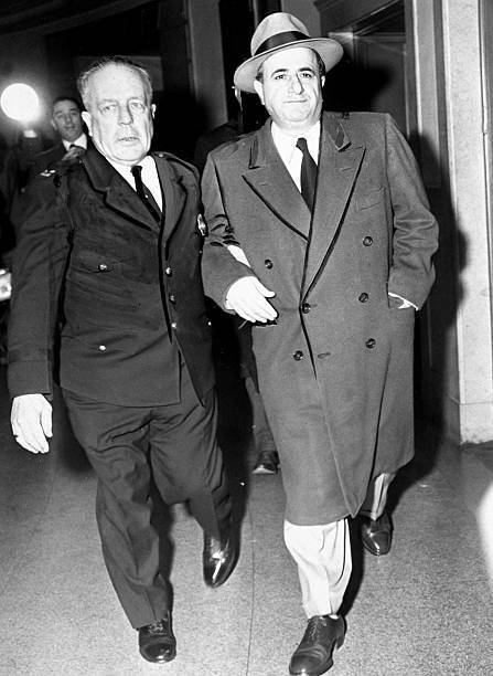 Albert Anastasia is helped along a Supreme Court hallway by Capt J .. Old Photo