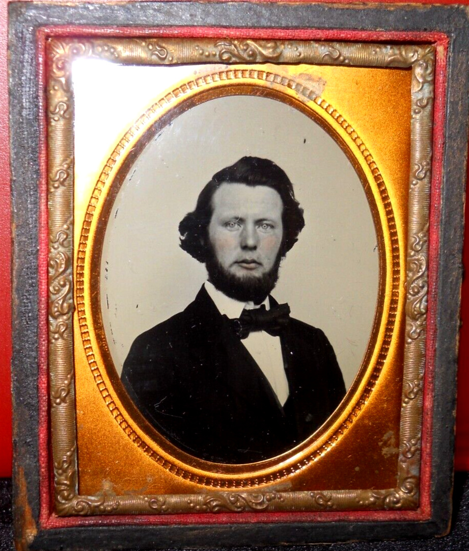 1/9th size Ruby Ambrotype of young man in half case