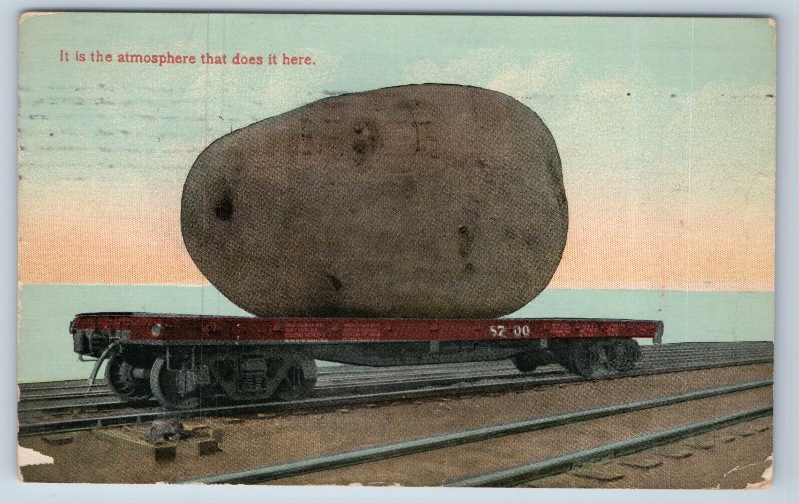 Postcard Exaggerated Potato Train Flatcar It is the Atmosphere Idaho 